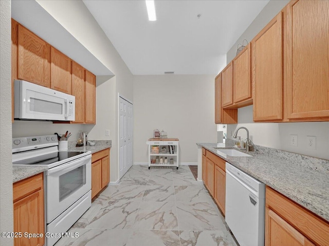 4086 Meander Pl Unit 104, Rockledge, FL 32955 - kitchen featuring white appliances, light marble finish floors, and light stone counters