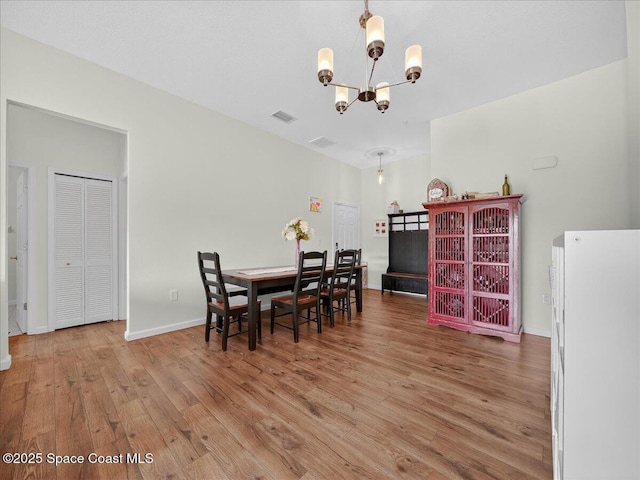 4086 Meander Pl Unit 104, Rockledge, FL 32955 - dining space featuring a chandelier and light wood-style flooring