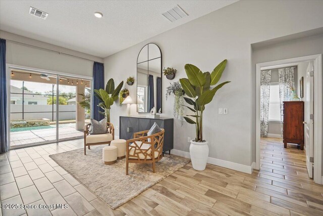 4692 Shannock Ave, Merritt Island, FL 32953 - living area featuring wood finished floors and a textured ceiling