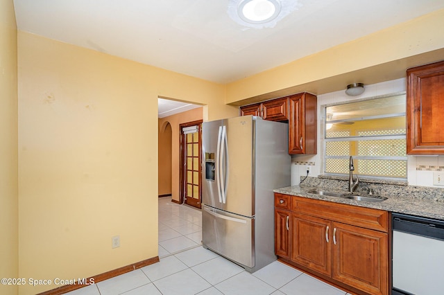 755 Haftez St NE, Palm Bay, FL 32907 - kitchen featuring stainless steel fridge with ice dispenser, dishwasher, light stone countertops, and light tile patterned floors