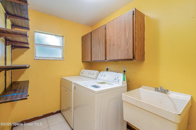 755 Haftez St NE, Palm Bay, FL 32907 - laundry area featuring cabinet space, independent washer and dryer, and light tile patterned flooring