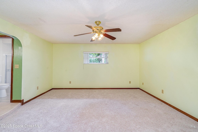 755 Haftez St NE, Palm Bay, FL 32907 - carpeted spare room featuring arched walkways, ceiling fan, and a textured ceiling
