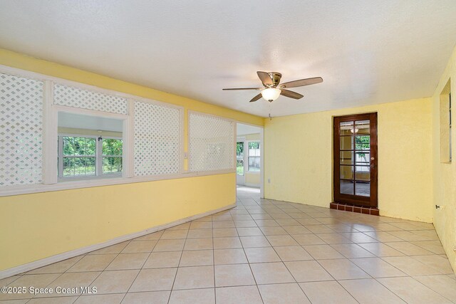 755 Haftez St NE, Palm Bay, FL 32907 - spare room with ceiling fan and light tile patterned floors
