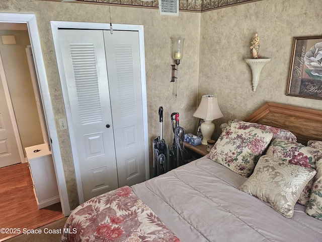 997 Sonesta Ave NE Unit 202, Palm Bay, FL 32905 - bedroom featuring a closet and wood finished floors