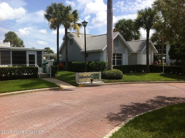 997 Sonesta Ave NE Unit 202, Palm Bay, FL 32905 - view of front of property with a front lawn and stucco siding