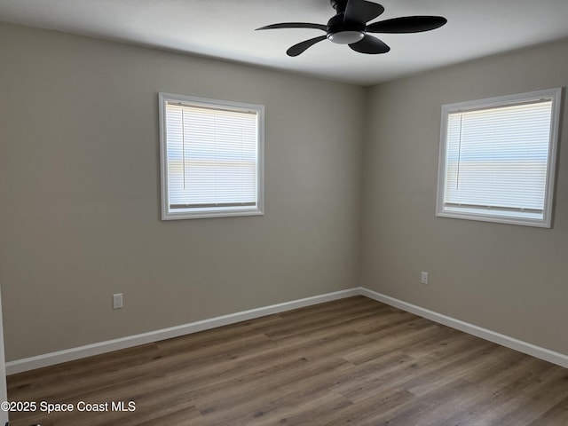 4111 Edward St, Melbourne, FL 32901 - spare room with healthy amount of natural light, wood finished floors, and ceiling fan