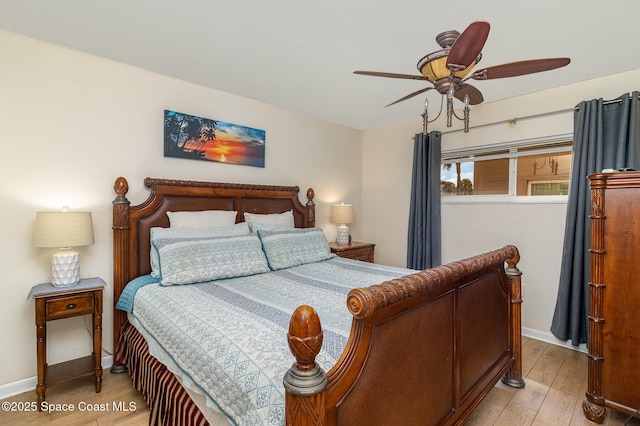 3150 N Atlantic Ave Unit 7-440, Cocoa Beach, FL 32931 - bedroom featuring light wood finished floors and a ceiling fan