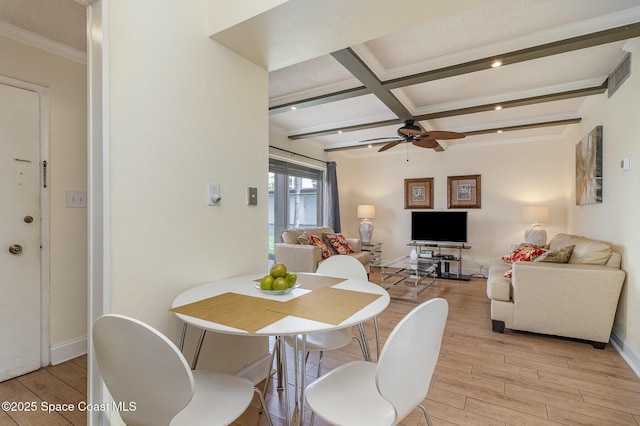 3150 N Atlantic Ave Unit 7-440, Cocoa Beach, FL 32931 - dining room featuring light wood-type flooring, beam ceiling, a ceiling fan, coffered ceiling, and ornamental molding
