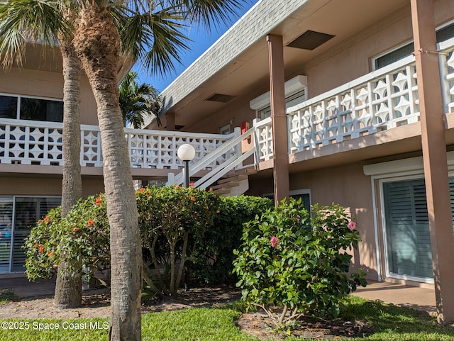 3150 N Atlantic Ave Unit 7-440, Cocoa Beach, FL 32931 - view of side of property featuring a balcony and stucco siding