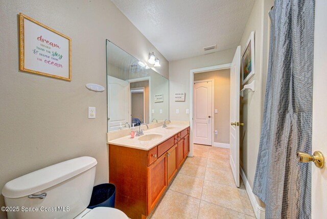 4082 Brantley Cir, Rockledge, FL 32955 - bathroom featuring double vanity and tile patterned floors