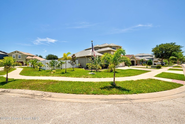 4082 Brantley Cir, Rockledge, FL 32955 - view of front of house featuring concrete driveway, a front yard, an attached garage, a residential view, and stucco siding