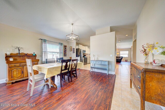 4082 Brantley Cir, Rockledge, FL 32955 - dining room with plenty of natural light, a chandelier, and light wood finished floors