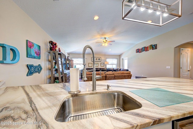 4082 Brantley Cir, Rockledge, FL 32955 - kitchen with vaulted ceiling, ceiling fan, arched walkways, and open floor plan