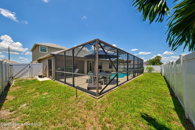 4082 Brantley Cir, Rockledge, FL 32955 - back of property with a fenced backyard, a patio, a gate, and glass enclosure