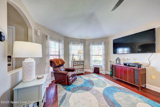 4082 Brantley Cir, Rockledge, FL 32955 - living area featuring wood finished floors, a textured ceiling, and plenty of natural light