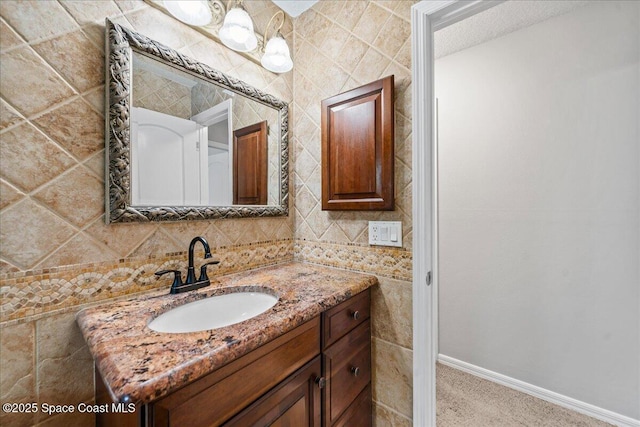 380 Cherry Ct, Satellite Beach, FL 32937 - bathroom featuring vanity, tile walls, and backsplash