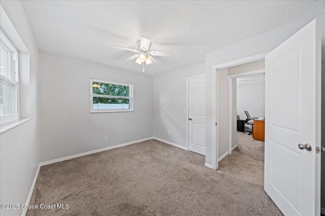 380 Cherry Ct, Satellite Beach, FL 32937 - spare room featuring a ceiling fan, carpet floors, a textured ceiling, and an office area