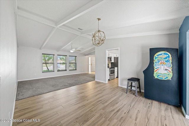 380 Cherry Ct, Satellite Beach, FL 32937 - unfurnished room featuring wood finished floors, a chandelier, and ceiling fan