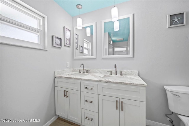 380 Cherry Ct, Satellite Beach, FL 32937 - bathroom with double vanity and baseboards
