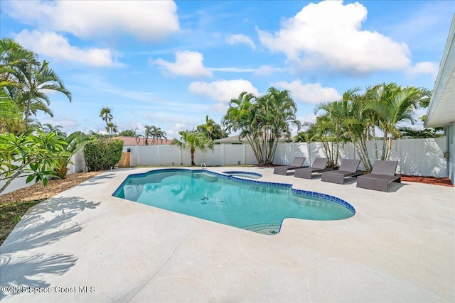 380 Cherry Ct, Satellite Beach, FL 32937 - view of swimming pool with a patio, a fenced backyard, and a pool with connected hot tub