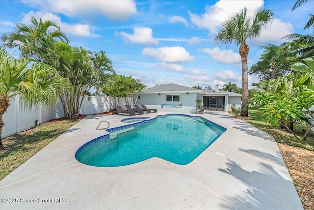 380 Cherry Ct, Satellite Beach, FL 32937 - view of swimming pool with a patio, a fenced backyard, and a pool with connected hot tub
