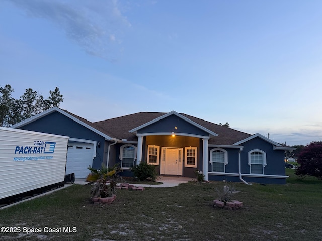 13350 SW 86th Ave SW, Ocala, FL 34473 - single story home featuring a garage, roof with shingles, a front yard, stucco siding, and covered porch