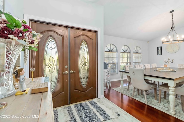 1276 Cypress Trace Dr, Melbourne, FL 32940 - foyer with a chandelier and wood finished floors
