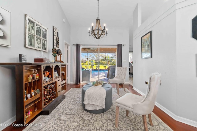 1276 Cypress Trace Dr, Melbourne, FL 32940 - sitting room featuring a chandelier and wood finished floors