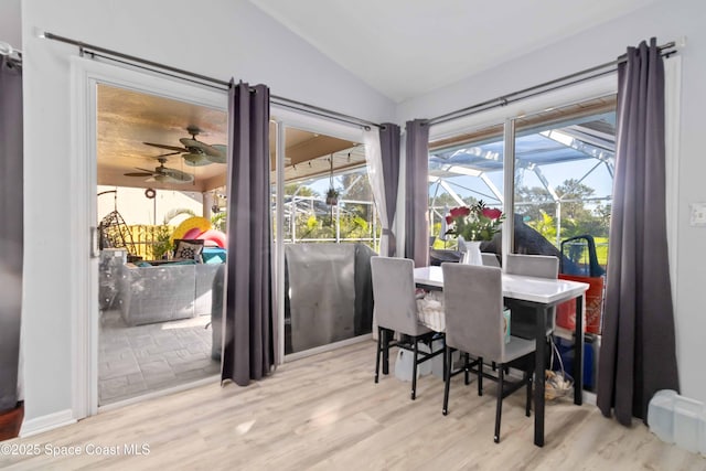 1276 Cypress Trace Dr, Melbourne, FL 32940 - dining space with lofted ceiling, a sunroom, wood finished floors, and ceiling fan