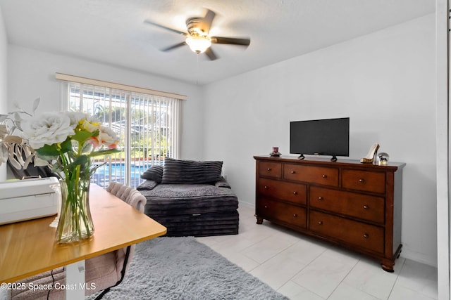 1276 Cypress Trace Dr, Melbourne, FL 32940 - living area featuring a ceiling fan and light tile patterned floors