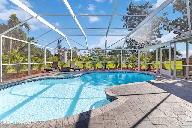 1276 Cypress Trace Dr, Melbourne, FL 32940 - view of swimming pool with glass enclosure, a patio area, and a pool with connected hot tub