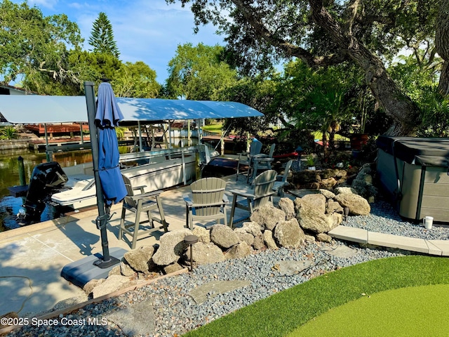 52 Riverview Ln, Cocoa Beach, FL 32931 - view of patio with a boat dock