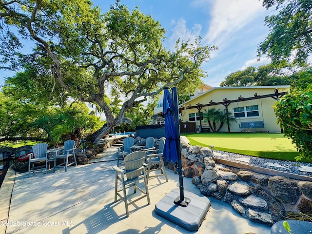52 Riverview Ln, Cocoa Beach, FL 32931 - view of patio featuring an area to practice putting