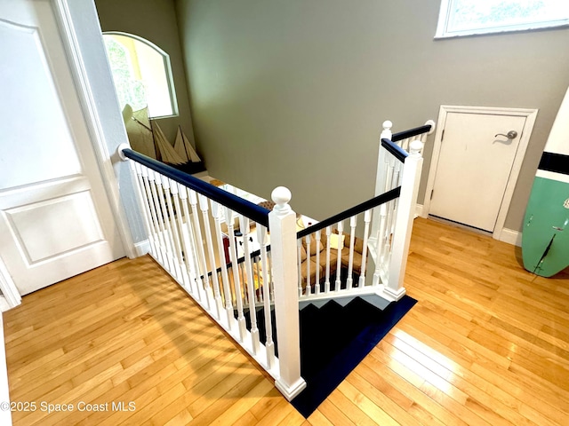 52 Riverview Ln, Cocoa Beach, FL 32931 - staircase featuring hardwood / wood-style flooring