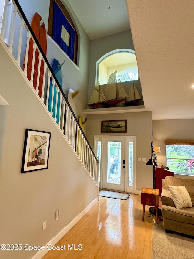 52 Riverview Ln, Cocoa Beach, FL 32931 - entryway featuring hardwood / wood-style flooring and stairs
