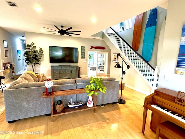 52 Riverview Ln, Cocoa Beach, FL 32931 - living room featuring stairway, a ceiling fan, wood-type flooring, and recessed lighting