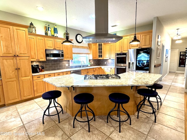 52 Riverview Ln, Cocoa Beach, FL 32931 - kitchen with stainless steel appliances, tasteful backsplash, a spacious island, island exhaust hood, and a kitchen breakfast bar