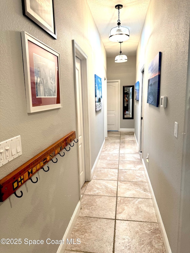 52 Riverview Ln, Cocoa Beach, FL 32931 - hallway featuring baseboards