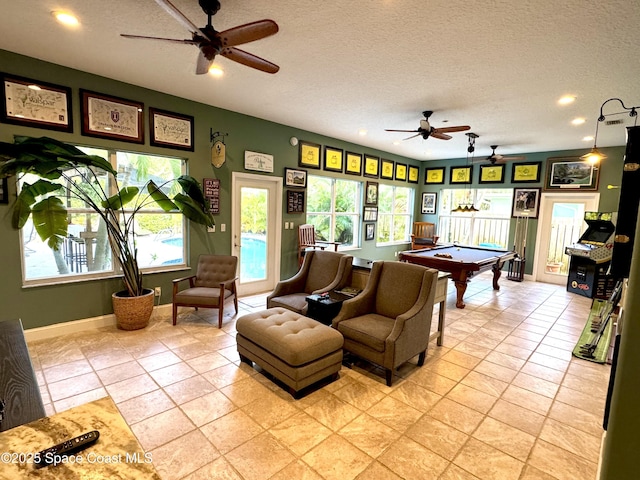 52 Riverview Ln, Cocoa Beach, FL 32931 - living room with ceiling fan, pool table, a textured ceiling, and recessed lighting