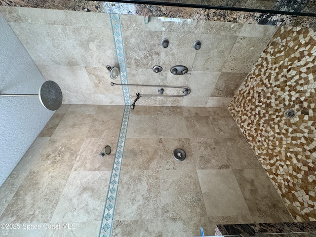 52 Riverview Ln, Cocoa Beach, FL 32931 - full bathroom with tiled shower and a textured wall