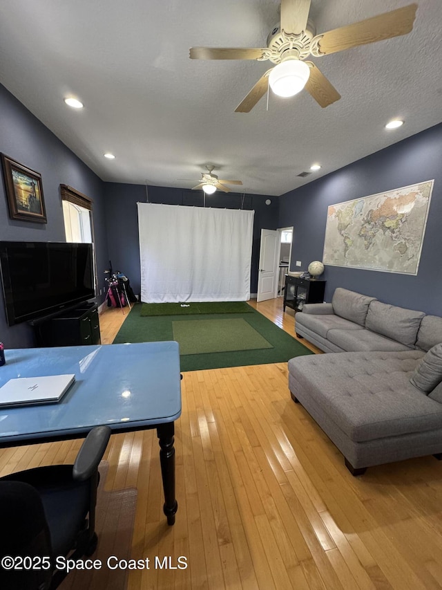52 Riverview Ln, Cocoa Beach, FL 32931 - playroom featuring golf simulator and hardwood / wood-style flooring