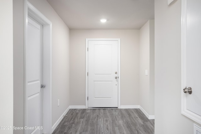 899 Brickell St SE, Palm Bay, FL 32909 - hallway featuring wood finished floors and recessed lighting