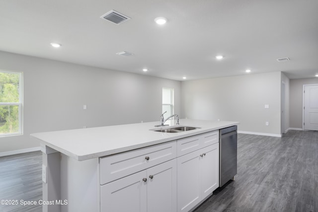 899 Brickell St SE, Palm Bay, FL 32909 - kitchen featuring an island with sink, stainless steel dishwasher, recessed lighting, light countertops, and healthy amount of natural light