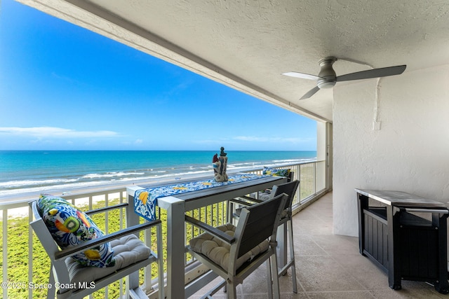 830 N Atlantic Ave Unit 903, Cocoa Beach, FL 32931 - balcony with view of water and beach and ceiling fan