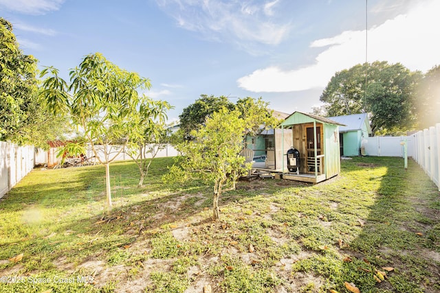 1139 Price Ave NW, Palm Bay, FL 32907 - fenced backyard with a storage unit