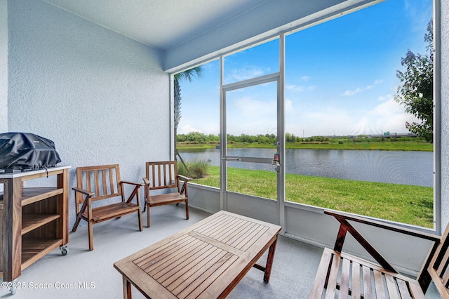 3930 Playa Del Sol Dr Unit 106, Rockledge, FL 32955 - sunroom featuring a water view and healthy amount of natural light