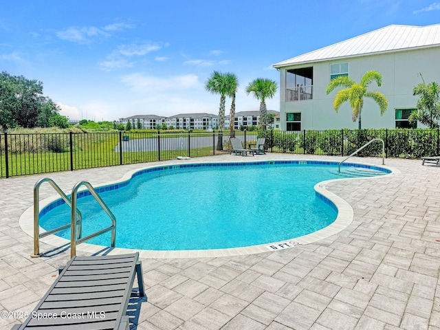 3930 Playa Del Sol Dr Unit 106, Rockledge, FL 32955 - community pool featuring a patio