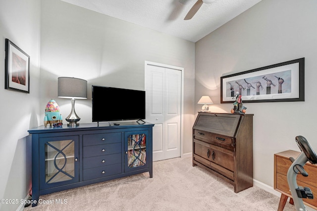 3930 Playa Del Sol Dr Unit 106, Rockledge, FL 32955 - bedroom featuring a closet, light carpet, a textured ceiling, and ceiling fan