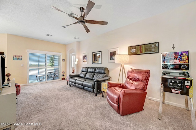 3930 Playa Del Sol Dr Unit 106, Rockledge, FL 32955 - living area with carpet, a ceiling fan, and arched walkways