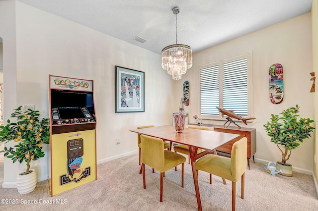 3930 Playa Del Sol Dr Unit 106, Rockledge, FL 32955 - carpeted dining area featuring a chandelier and baseboards